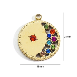Detailed view of a gold crescent moon pendant with colorful rhinestones and dimensions
