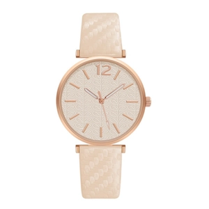 Detail of rose gold quartz watch featuring beige strap with embossed leaf pattern