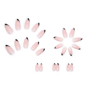 Uñas postizas de almendra con base rosa, puntas blancas y diseño negro bicolor