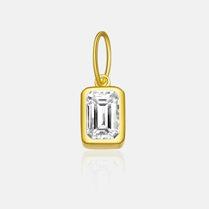 Detail of emerald cut clear cubic zirconia stone in a square gold necklace pendant