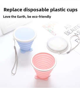 Collapsible silicone travel cups in pink and blue with metal rim and lanyards