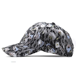 Detailed side view of floral lace embroidery on high-quality black hip hop baseball cap