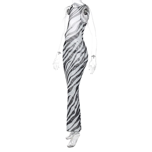 Detail of sheer zebra print mesh fabric on a slim fit sleeveless maxi dress silhouette