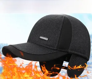 Detail view of winter baseball cap for men featuring thickened ear flaps and metal sport badge