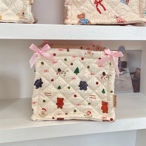 Quilted beige storage basket with cute Christmas bear print and pink bow detailing