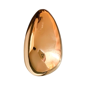Irregular oval rose gold brooch with a high-polished mirror finish in minimalist style