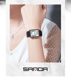 Classic rectangle lady watch with black leather strap and Roman numerals on white dial