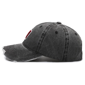 Vintage distressed baseball cap in dark grey with red letter embroidery and frayed brim