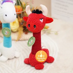 Durable squeaky plush cow toy for dogs made of textured corduroy in vibrant red