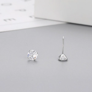 Detailed view of S925 sterling silver six-prong stud earrings with round white zircon