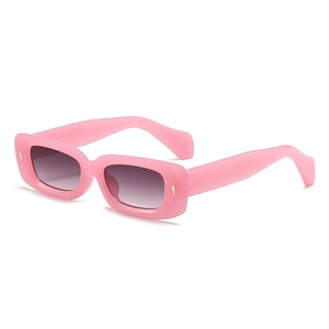 Retro small square sunglasses with pink frame and golden diamond accents in 45-degree view
