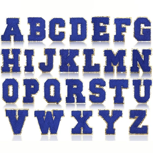 Set of 26 royal blue chenille letter patches with gold glitter borders for DIY sewing