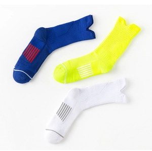 Detail view of anti-slip mid-calf sports socks with zonal compression and towel-bottom texture