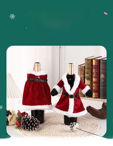 Detail of red velvet Christmas wine bottle covers with Santa suit and dress designs