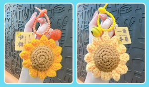 Detailed view of handmade crochet sunflower keychains featuring small bells and gift tags.
