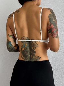 Detailed back view of adjustable thin white straps on a sexy French triangle bra