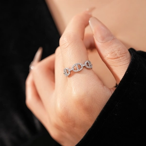 Close-up of a silver-toned pig nose anchor link ring with shimmering pave-set cubic zirconia