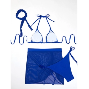 Detailed view of royal blue 4-piece bikini set with mesh skirt and matching hair accessory