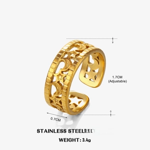 Detail shot of the 18k gold plated stainless steel ring featuring celestial star patterns