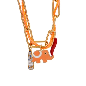 Detailed close-up of elephant and pepper charms on a woven stainless steel gold chain