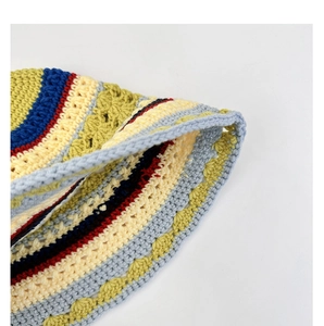 Close-up of multicolor striped crochet hat showing detailed handmade knitting texture