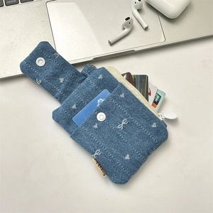 Blue denim card holder with white heart embroidery and multi-slot interior storage