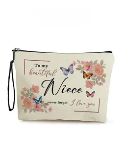 Detailansicht der Leinwand-Kosmetiktasche mit Blumendruck und Nichten-Zitaten