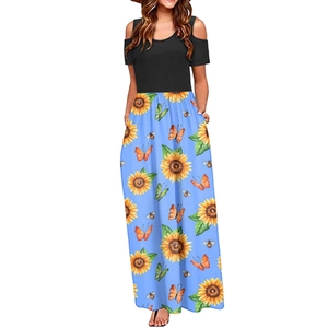 Detail of cold-shoulder short sleeves with sunflower and butterfly prints on dress