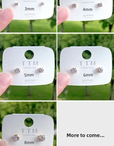 Detailed size comparison of 3mm to 8mm zircon stud earrings on display cards