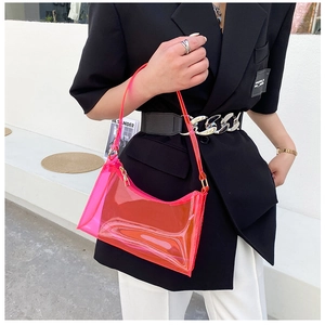 Close-up of fluorescent pink jelly baguette bag with clear PVC texture and zipper detail