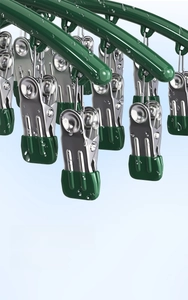 Close-up of green rubber-coated clips on stainless steel rack with anti-rust feature
