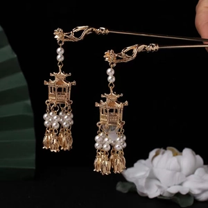 Golden Chinese lantern hairpins with tassels and pearls in a vintage oriental style