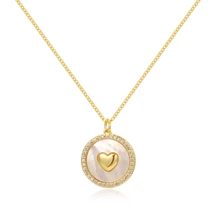 Close-up of heart-shaped gold necklace pendant with white pearl inlay and zircon border