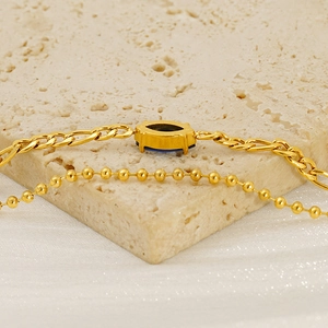 Double-layered golden titanium steel bracelet with blue marquise zircon and Figaro chain link