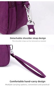 Detail of the durable purple nylon handbag showing detachable strap and metal hook clips