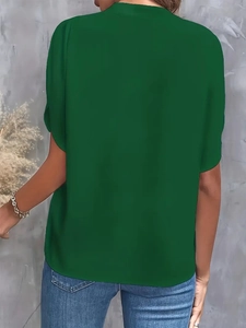 Detailed back view of a dark green V-neck casual summer shirt for women on a model