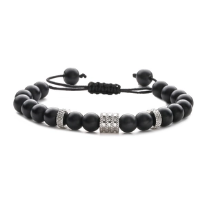 Detail of adjustable braided bracelet with matte black onyx beads and silver charms