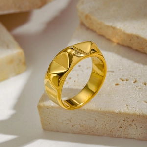 French vintage irregular line gold earrings with geometric facets on a stone base