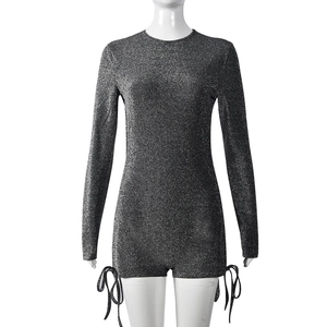Detail of silver glitter long sleeve bodysuit featuring drawstring hem and round neckline