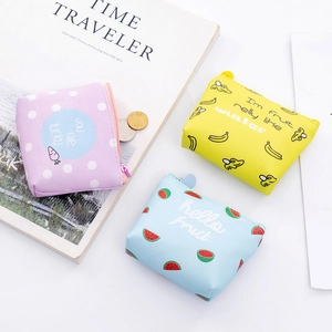 Detailed view of colorful PU leather coin purses with banana and watermelon patterns