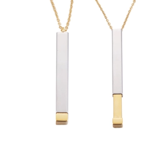Detail showing retractable pendant mechanism in closed and extended states on a gold chain