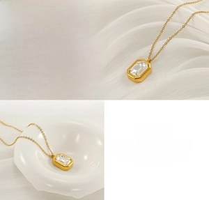 Detail of gold-plated stainless steel necklace with rectangular zircon stone setting