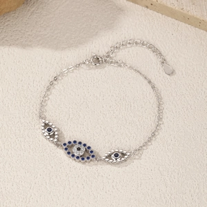 Minimalist S925 sterling silver evil eye bracelet with blue crystals and adjustable chain