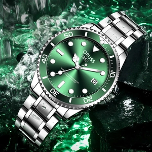 Waterproof silver steel watch with green dial on wet rock for professional business use