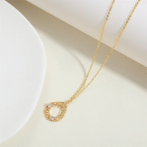 14K gold plated branch pendant necklace featuring hollow weave design and white zircons
