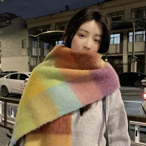 Rainbow checkered mohair scarf for women styled on a model in urban night setting