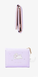 Close-up of purple trifold wallet featuring cute rabbit design and white pompom charm