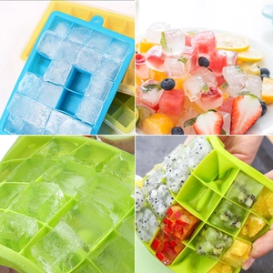 24-grid silicone ice cube molds in blue and green with fresh fruit infused cubes