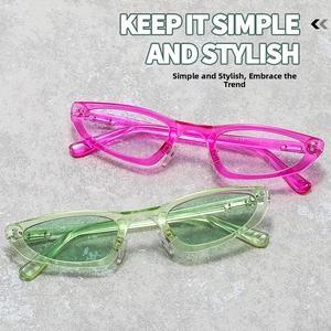 Detail view of pink and green cat eye frames with inner arm size specs and CE mark