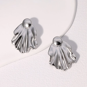 Minimalist silver irregular pleated fan-shaped stainless steel stud earrings on white pedestal